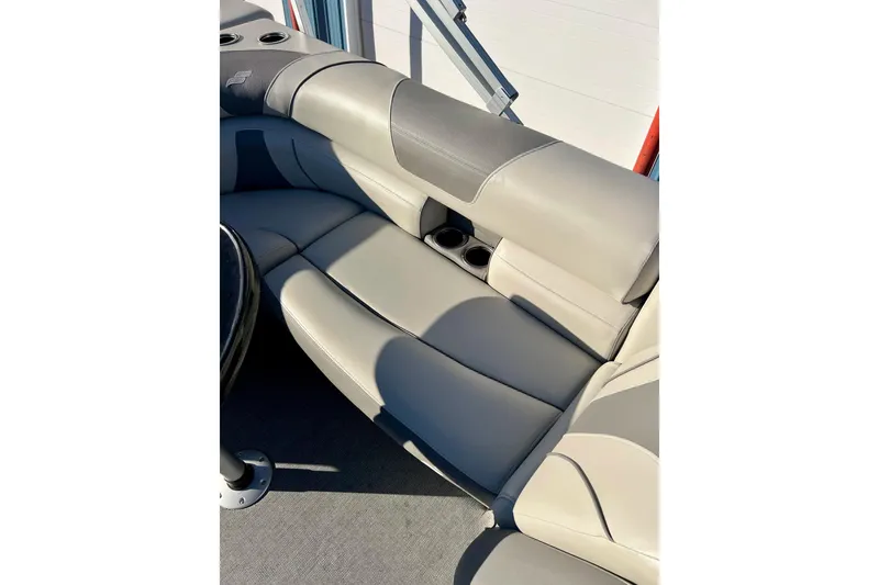 Slide: The Image of 2021 SMOKERCRAFT EX20C boat interior with light blue cushioned seating. - 42