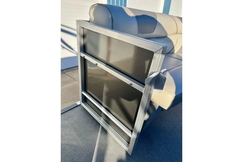 Slide: The Image of 2021 SMOKERCRAFT EX20C boat interior with captain's chair and control console. - 55