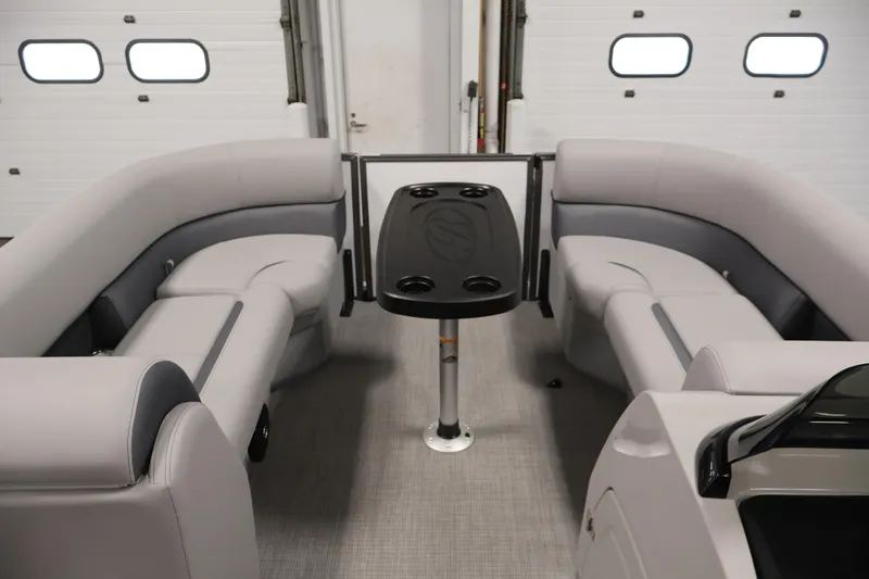 Slide: The Image of 2026 Bentley Pontoons 220 SWINGBACK interior with gray seating and central table. - 10