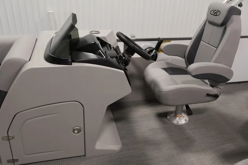 Slide: The Image of 2026 Bentley Pontoons 220 SWINGBACK helm with modern steering and comfortable captain's chair. - 16