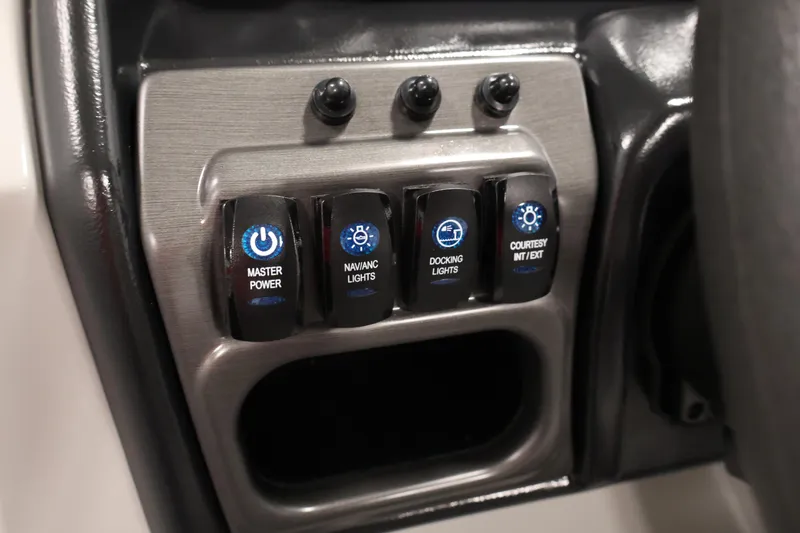 Slide: The Image of Control panel of 2026 Bentley Pontoons 220 SWINGBACK with power and lighting switches. - 21