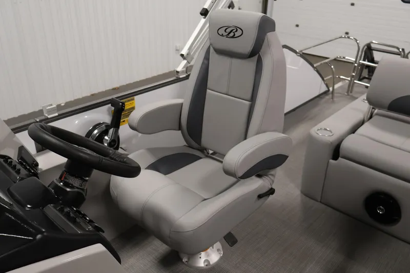 Slide: The Image of 2026 Bentley Pontoons 220 SWINGBACK captain's chair and steering wheel in sleek interior design. - 25