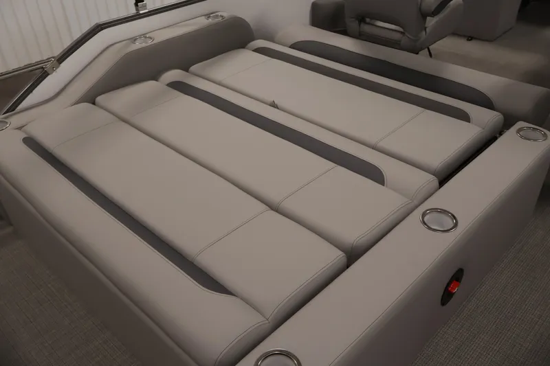 Slide: The Image of 2026 Bentley Pontoons 220 SWINGBACK interior seating with sleek, modern design and cup holders. - 28