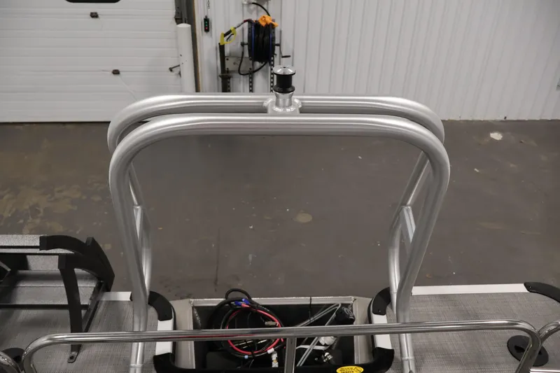 Slide: The Image of 2026 Bentley Pontoons 220 SWINGBACK boat ladder and deck detail in a garage setting. - 30