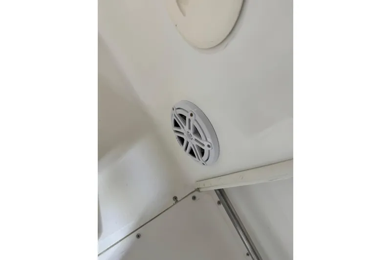 Slide: The Image of Speaker installed on a 2000 Boston Whaler 21 Outrage boat interior. - 10