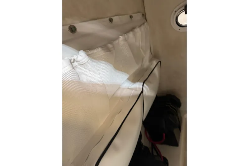 Slide: The Image of Interior storage compartment of a 2000 Boston Whaler 21 Outrage boat. - 12