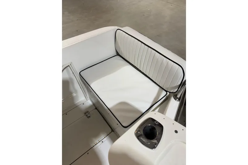 Slide: The Image of White cushioned seating on a 2000 Boston Whaler 21 Outrage boat. - 4