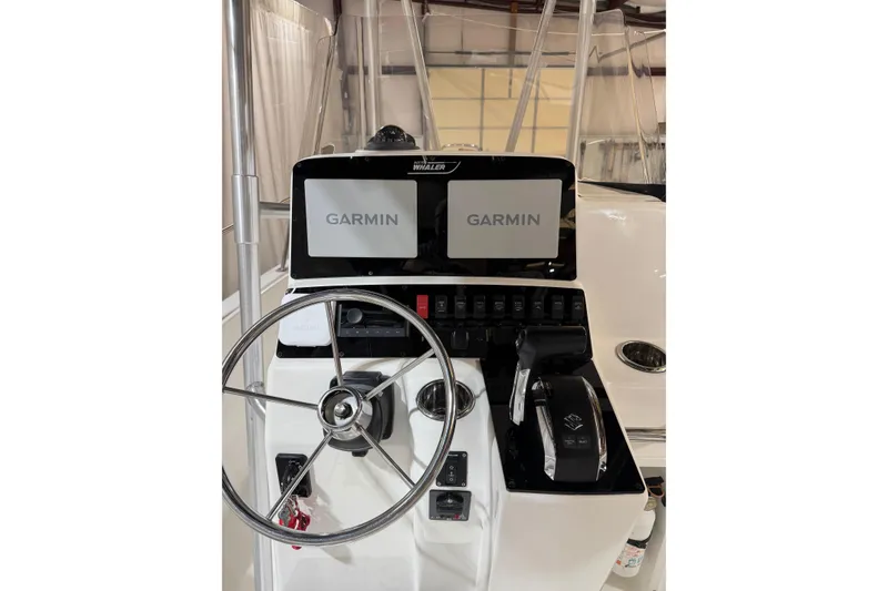 Slide: The Image of Boston Whaler 21 Outrage 2000 boat dashboard with Garmin navigation system. - 8