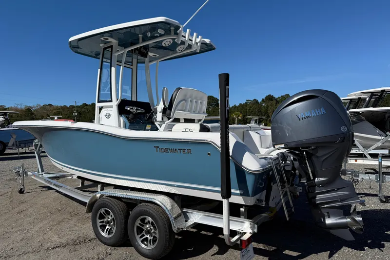 Slide: The Image of 2026 Tidewater 210 LXF boat on trailer with Yamaha engine, blue hull, sunny day. - 11