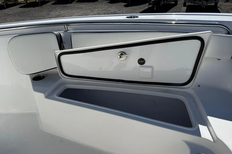 Slide: The Image of 2026 Tidewater 210 LXF boat storage compartment with open hatch, showcasing sleek design. - 17