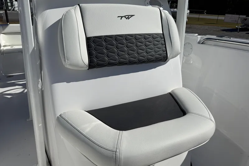 Slide: The Image of 2026 Tidewater 210 LXF boat seat with black and white upholstery. - 18