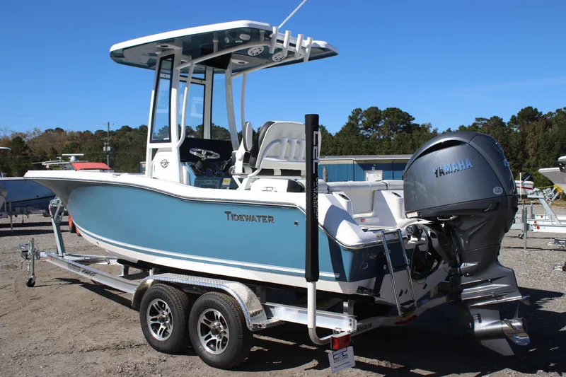 Slide: The Image of 2026 Tidewater 210 LXF boat with Yamaha engine on a trailer, parked outdoors. - 3