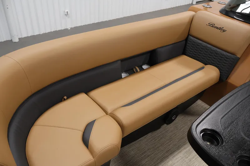 Slide: The Image of 2026 Bentley Pontoons 243 Swingback Tri-toon, luxurious tan and black seating detail. - 13