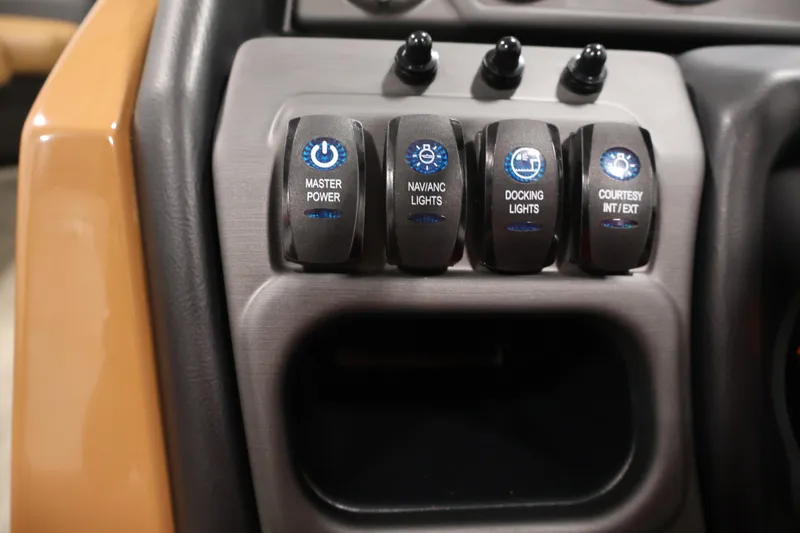 Slide: The Image of Control panel of 2026 Bentley Pontoons 243 Swingback Tri-toon with labeled switches. - 20