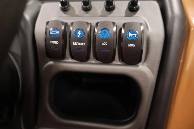 Slide: The Image of Control panel of 2026 Bentley Pontoons 243 Swingback Tri-toon with labeled switches. - 21