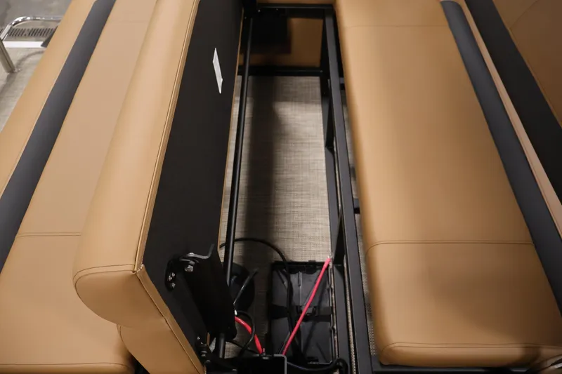 Slide: The Image of 2026 Bentley Pontoons 243 Swingback Tri-toon interior storage compartment with tan seating. - 28