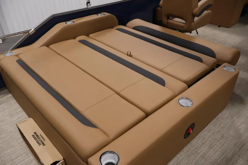 Slide: The Image of 2026 Bentley Pontoons 243 Swingback Tri-toon with luxurious tan seating and cup holders. - 29