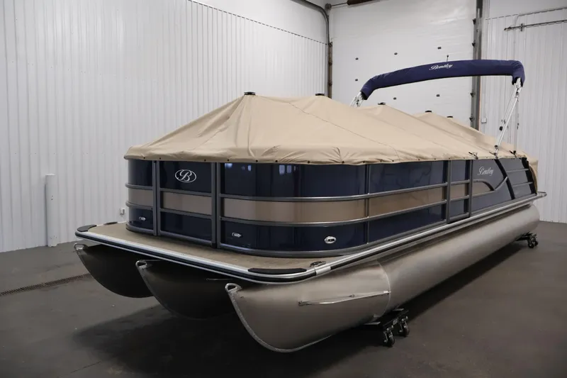 Slide: The Image of 2026 Bentley Pontoons 243 Swingback Tri-toon with cover in indoor storage. - 32