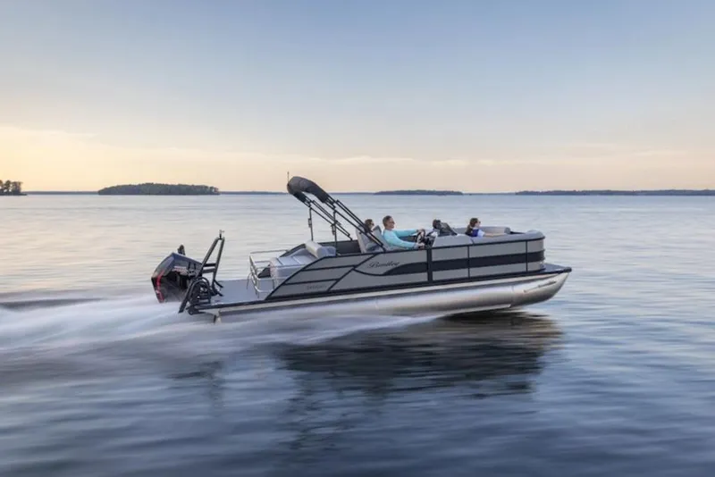 Slide: The Image of 2026 Bentley Pontoons 243 Swingback Tri-toon interior with tan seating and central table. - 9