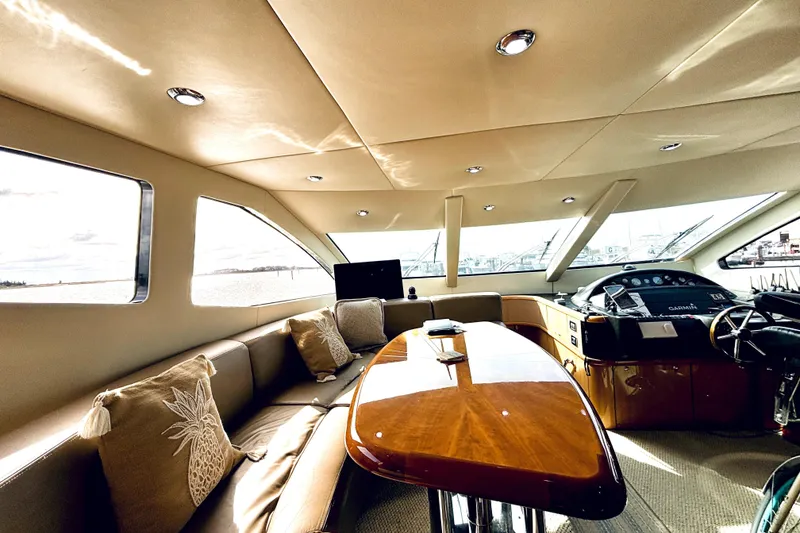Slide: The Image of Luxurious interior of a 2005 Sunseeker 75 Sport Yacht with elegant seating and helm. - 11