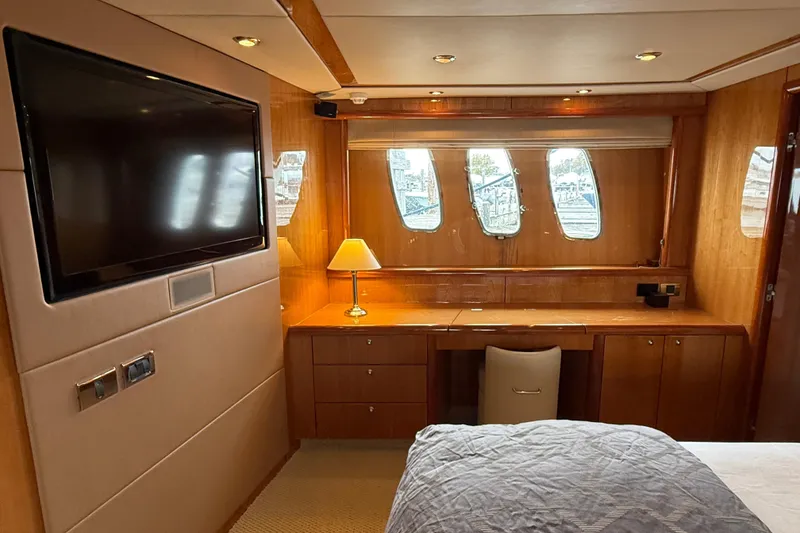 Slide: The Image of Luxurious cabin interior of a 2005 Sunseeker 75 Sport Yacht with TV and desk. - 20