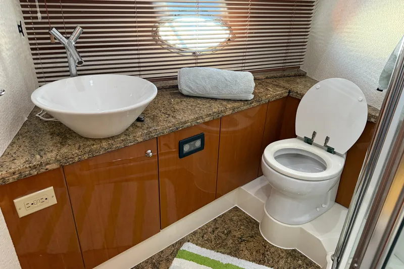 Slide: The Image of Luxurious bathroom in 2005 Sunseeker 75 Sport Yacht with modern fixtures and granite countertop. - 28
