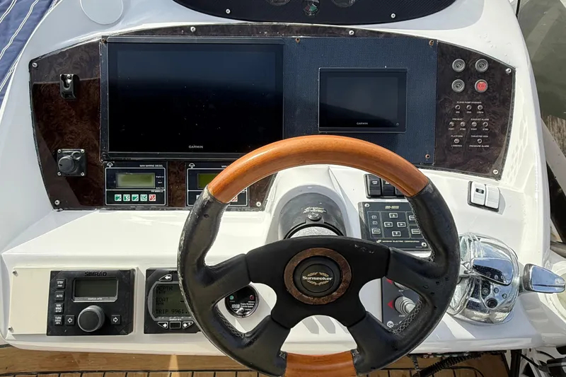 Slide: The Image of Steering console of 2005 Sunseeker 75 Sport Yacht with navigation screens and controls. - 46