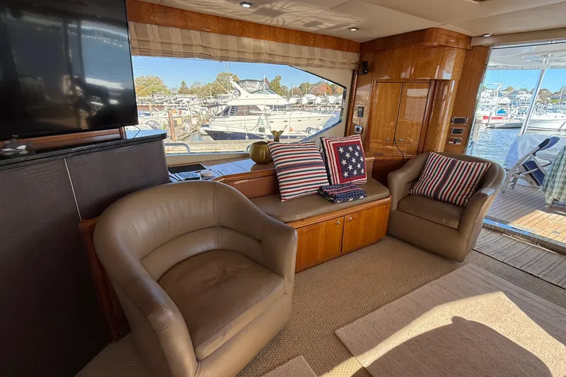 Slide: The Image of Luxurious interior of 2005 Sunseeker 75 Sport Yacht with leather chairs and nautical decor. - 7