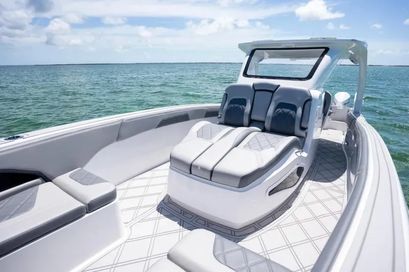 Slide: The Image of 2024 Deep Impact 369 Sport boat with luxurious seating on open water. - 10