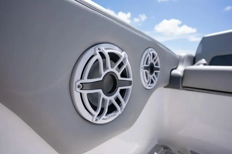 Slide: The Image of 2024 Deep Impact 369 Sport boat speakers with sleek design against blue sky. - 22