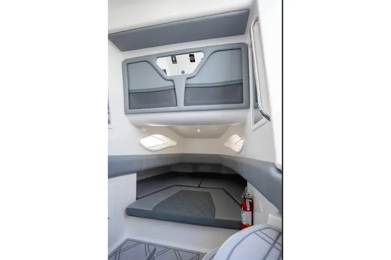 Slide: The Image of Interior cabin of 2024 Deep Impact 369 Sport boat, featuring modern design and storage. - 31