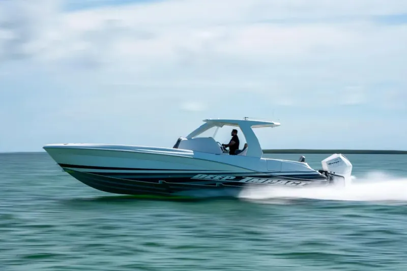 Slide: The Image of 2024 Deep Impact 369 Sport boat speeding on open water. - 33