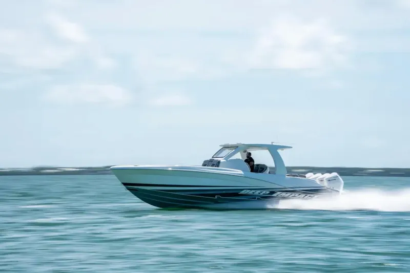 Slide: The Image of 2024 Deep Impact 369 Sport boat speeding on open water. - 40