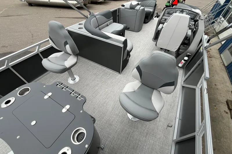 Slide: The Image of 2025 Avalon LSZ Rear Fish boat interior with gray seating and fishing setup. - 14