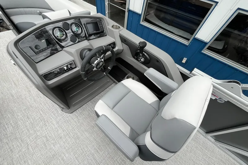 Slide: The Image of 2025 Avalon LSZ Rear Fish boat cockpit with modern steering and controls. - 16