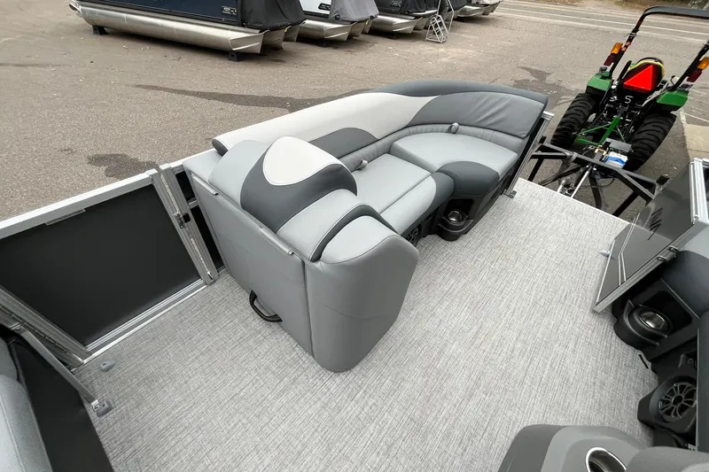 Slide: The Image of 2025 Avalon LSZ Rear Fish pontoon boat interior with gray seating and carpeted flooring. - 17