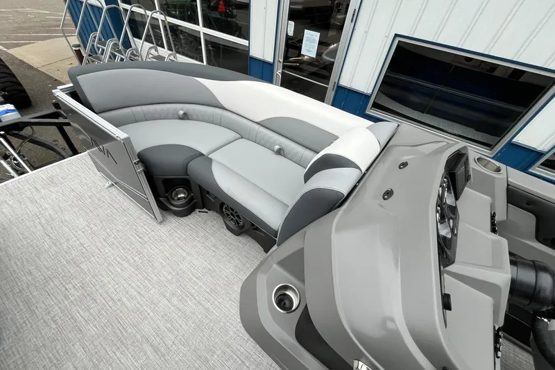 Slide: The Image of 2025 Avalon LSZ Rear Fish boat interior with gray seating and modern dashboard. - 18
