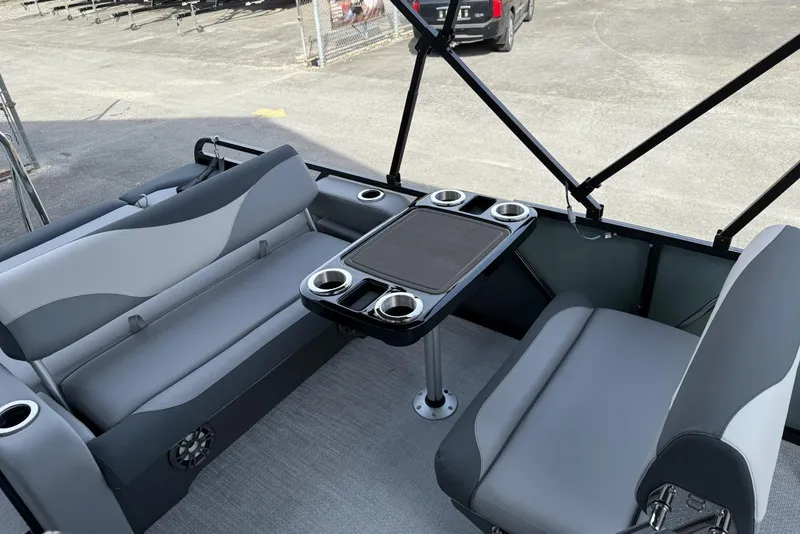 Slide: The Image of 2026 Avalon 2385 LSZ Entertainer boat interior with seating and table setup. - 6