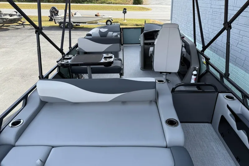 Slide: The Image of 2026 Avalon 2385 LSZ Entertainer pontoon boat interior with seating and helm. - 9