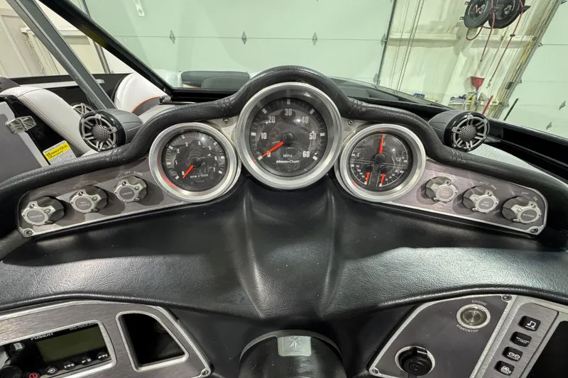 Slide: The Image of Dashboard of a 2017 MasterCraft X23 boat with gauges and controls. - 15