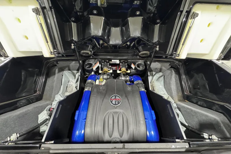 Slide: The Image of 2017 MasterCraft X23 engine compartment with blue hoses and Indmar engine cover. - 18