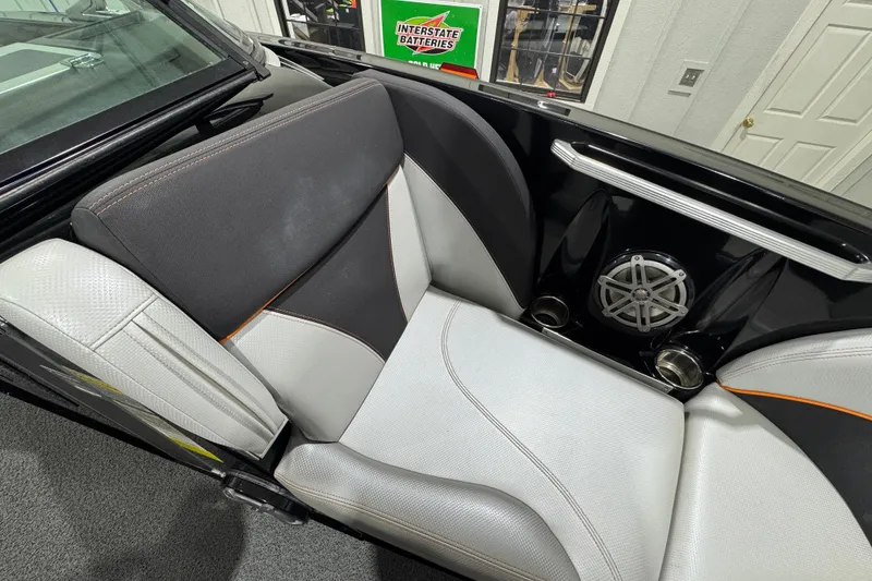 Slide: The Image of 2017 MasterCraft X23 boat interior with stylish seating and speaker system. - 20