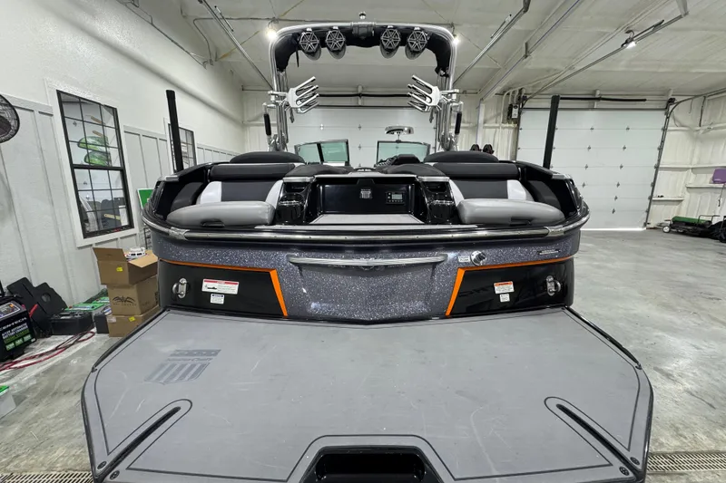 Slide: The Image of 2017 MasterCraft X23 boat in a garage, showcasing sleek design and modern features. - 3