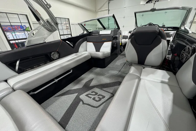 Slide: The Image of Interior of a 2017 MasterCraft X23 boat with sleek seating and modern design. - 8