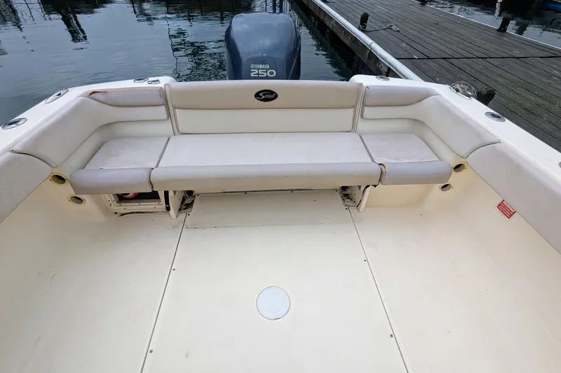 Slide: The Image of 2009 Scout 245 Dorado boat interior with Yamaha 250 engine, docked at marina. - 11