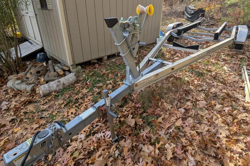 Slide: The Image of Boat trailer on autumn leaves near a shed, for 2009 Scout 245 Dorado. - 18