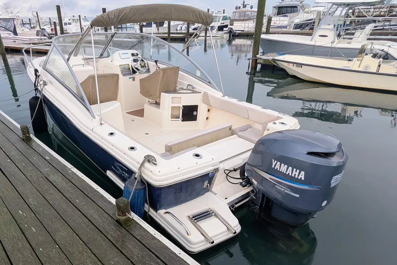 Slide: The Image of 2009 Scout 245 Dorado boat docked with Yamaha outboard engine. - 3