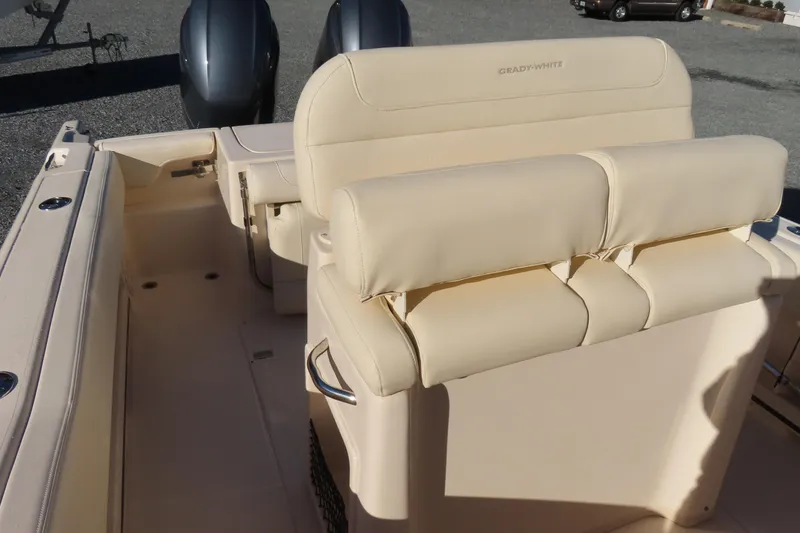Slide: The Image of 2019 Grady-White Fisherman 257 boat interior with beige seating and dual engines. - 16
