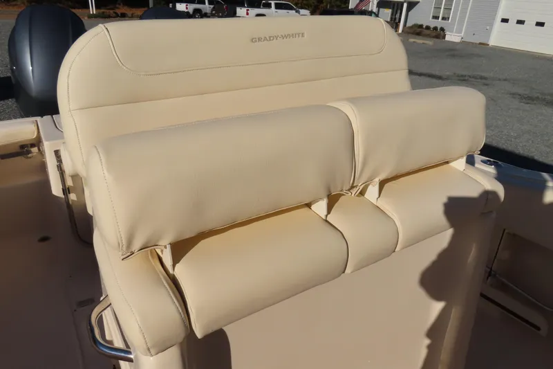 Slide: The Image of 2019 Grady-White Fisherman 257 boat seat, beige upholstery, outdoor setting. - 17