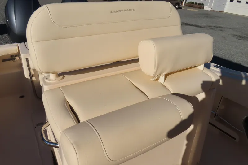 Slide: The Image of 2019 Grady-White Fisherman 257 boat seat, beige upholstery, outdoor setting. - 18